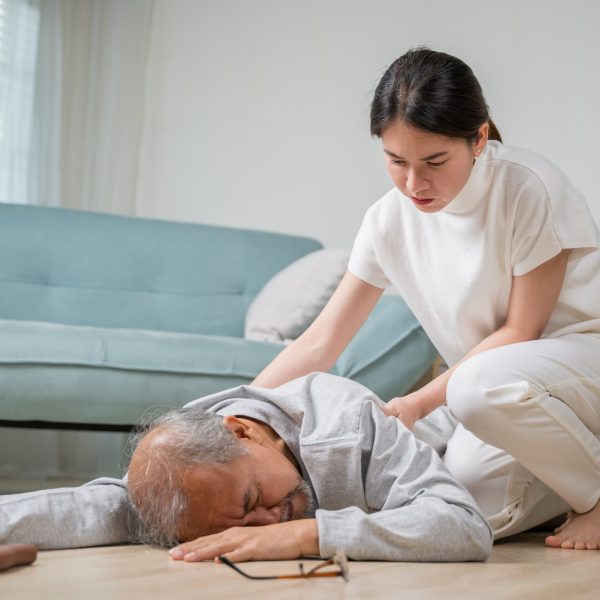 Asia,Young,Woman,Halping,Her,Father,After,Falling,Down,On